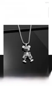 Detail of silver titanium steel bear pendant with mechanical joints and box chain