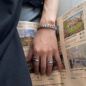 Men's titanium steel Cuban chain bracelet and textured rings in a modern urban style