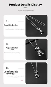 Detail of silver mechanical bear pendant with adjustable tail chain and polished finish