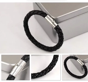 Close-up of black braided PU leather bracelet with polished silver magnetic metal clasp