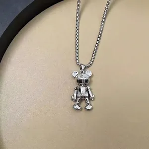 Polished titanium steel bear necklace with movable limbs on premium leather texture