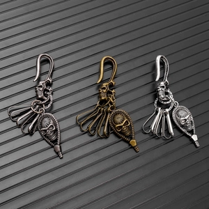 Detailed view of vintage skull keychains in gunblack, bronze, and silver metal finishes