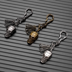 Vintage metal skull keychain with clip hooks in black, bronze, and silver gothic style