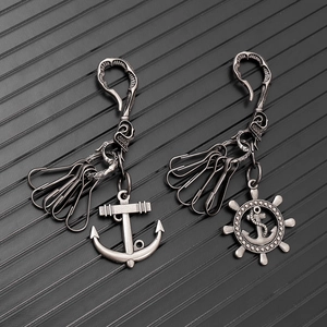 Vintage industrial anchor and rudder keychains in antique silver with detailed engravings