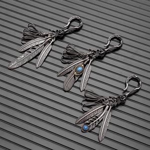 Retro turquoise feather keychain set with skull charms and antique silver finish style