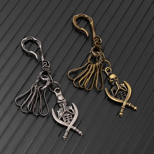 Retro punk skull pendants with crossed swords in antique silver and bronze finishes