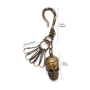 Vintage bronze skull keychain for pants with hip hop style hooks and detailed dimensions