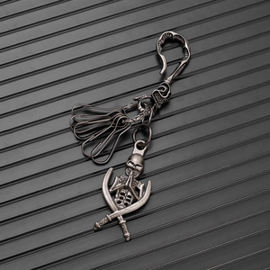Gothic punk skull and crossbones keychain with vintage metal finish and spring hook