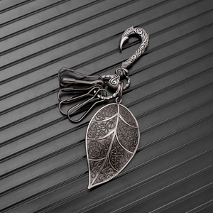 Retro punk leaf pendant keychain with distressed metal hook and vintage vine patterns