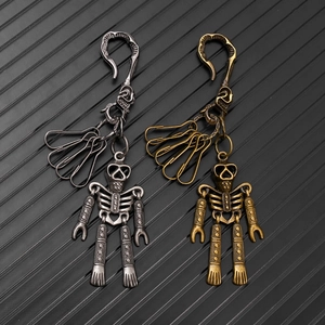 Detailed macro of steampunk mechanical skeleton keychains in vintage silver and bronze finish