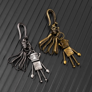 Retro punk robot keychain in gun black and bronze finish with movable joints and skull hook