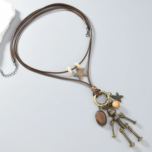 Macro view of vintage robot pendant with bronze hardware and brown woven rope chain