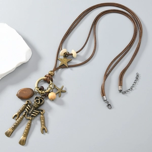 Vintage bronze skull and starfish pendant necklace with brown braided leather cord