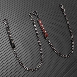 Punk style waist chain set in black and brown leather with rivet studs and metal alloy links