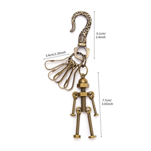 Portachiavi robot vintage in bronzo con giunti mobili e misure delle dimensioni mostrate