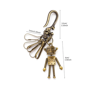 Vintage bronze robot keychain with movable limbs and pants hook accessory