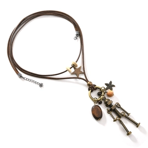 Retro punk robot pendant necklace with bronze stars and wooden beads on brown cord