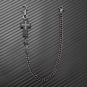 Detail of punk waist chain with cross skull leather patch and silver metal links