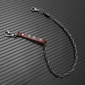 Punk metal wallet chain with brown leather strap and vintage floral studs detail