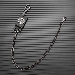 Detail of hip hop eagle pendant waist chain featuring black leather and metallic links