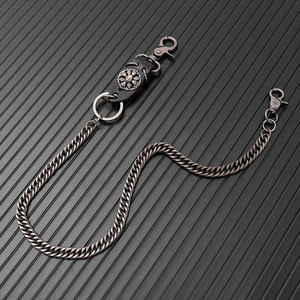 Detail of silver skull leather patch on heavy metal hip hop wallet trouser chain