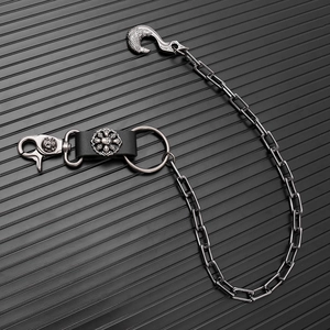 Gothic punk metal waist chain featuring crow head hook and skull embossed swivel snap link