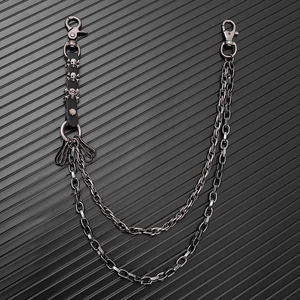 Dual-layer punk waist chain in dark grey metal with triple skull leather pendant detail