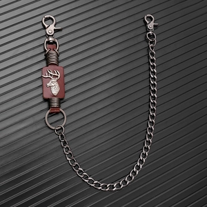 Punk style pants chain featuring gunmetal links, brown leather and a silver stag head logo