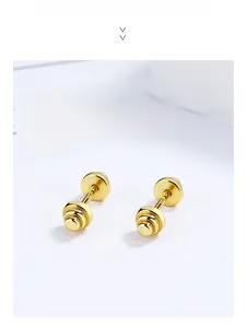 Detail of gold dumbbell-shaped 925 silver stud earrings with secure screw back closure