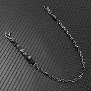 Industrial gunmetal trouser chain with black leather strap and vintage metal rivets
