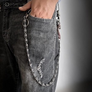 Punk hip hop metal wallet chain with vintage silver finish and leather details on denim