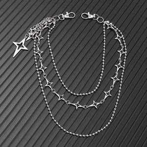 Close-up of triple-layered punk star waist chain with silver beads and lobster clasps
