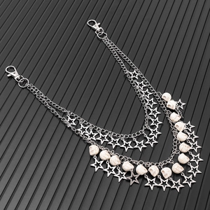Detail of punk silver double-layer trousers chain with skull and star charms