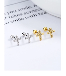 Macro view of cross stud earrings with micro-inlaid zircons and secure screw back design