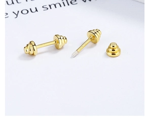 Detail of gold barbell earrings in S925 silver with a secure industrial screw-back closure