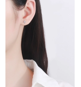 Close-up of 925 silver cross stud earring with micro-inlaid cubic zirconia stones