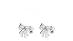 Detail of 925 silver bow stud earrings with hollow heart pattern and screw ball back
