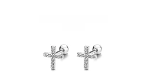 Detail of 925 sterling silver cross screw back earrings with sparkling zircon stones