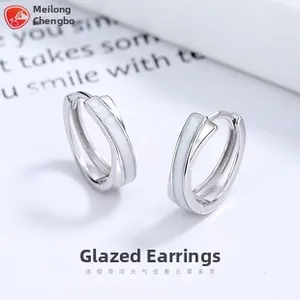 Detailed macro shot of 925 silver double-layer enamel hoop earrings with zircon accents