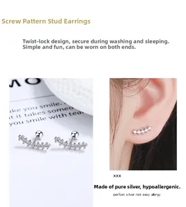 Macro detail of sterling silver curved bar earring with rhinestone and screw back closure