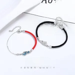 Close-up of S925 sterling silver Mobius couple bracelets with braided rope and mountain charms