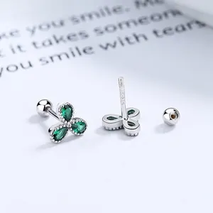 Macro view of S925 sterling silver clover stud earrings with green zircon petals
