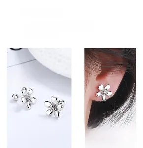 Detail of 925 sterling silver flower stud earrings with secure screw back closure