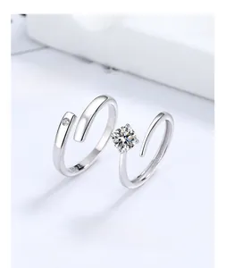 Detail of S925 sterling silver adjustable couple rings with cubic zirconia settings