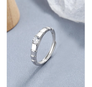 Macro shot of S925 sterling silver ring featuring bamboo texture and round zircon stone