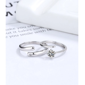 Macro detail of adjustable S925 silver couple rings featuring a sparkling zircon stone