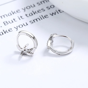 Elegant S925 sterling silver starfish hoop earrings with zircon stones on white card