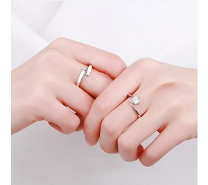 Detail shot of 925 sterling silver adjustable rings for couples with zircon on hand