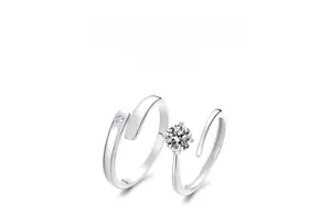 Detail of S925 sterling silver couple rings showing the hallmark and zircon setting