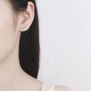 Minimalist silver curved crawler earrings with five clear cubic zirconia stones for women